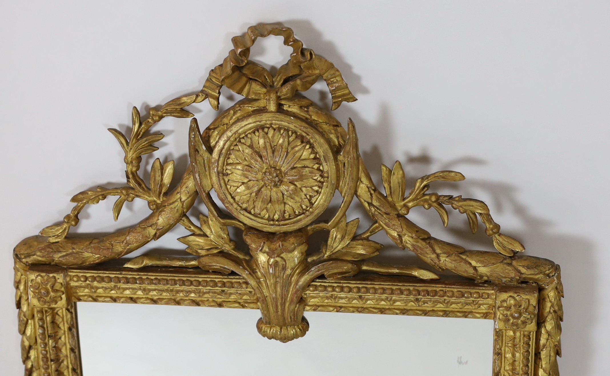 An early 19th century French gilt wood and gesso wall mirror, width 54cm height 110cm